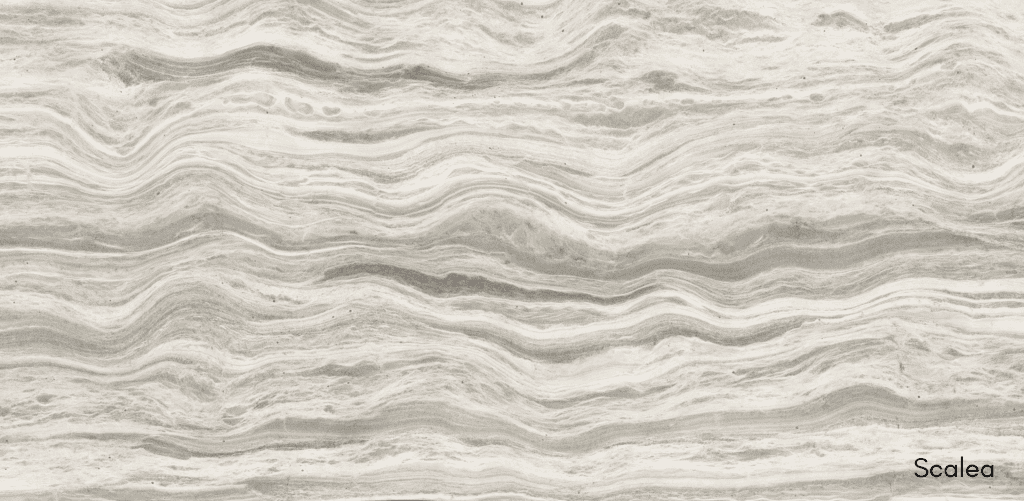 Custom kitchen cabinets featuring a Scalea natural stone countertop. Bespoke millwork for luxury home builders in Richmond.