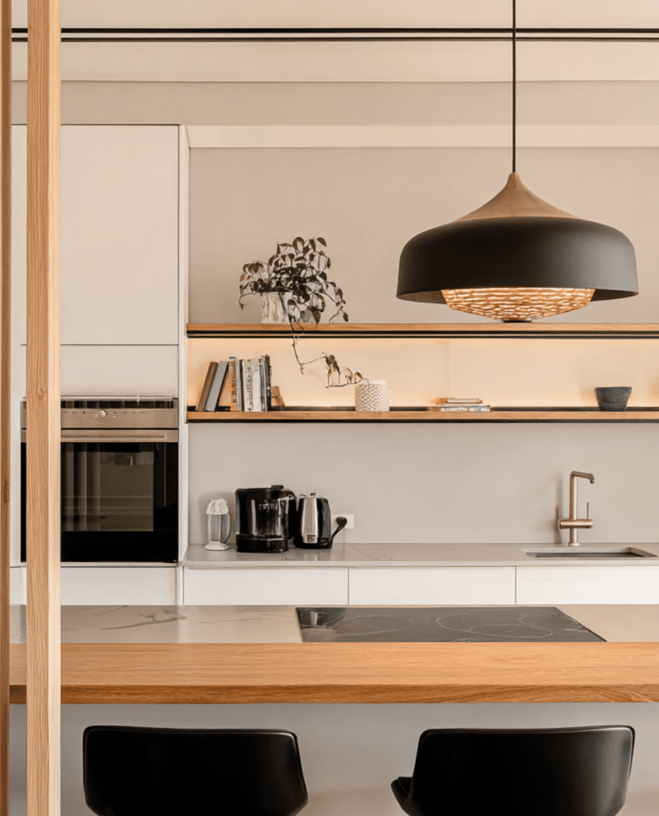 High-end white lacquer kitchen cabinetry designed to maximize natural light. Architectural bespoke millwork for modern living spaces in Burnaby.