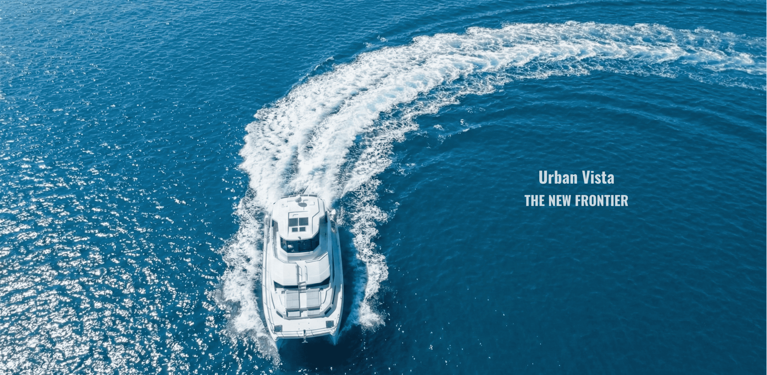 Aerial view of a luxury yacht on open water. Urban Vista pushes the new frontier of custom marine interior cabinetry in Vancouver.
