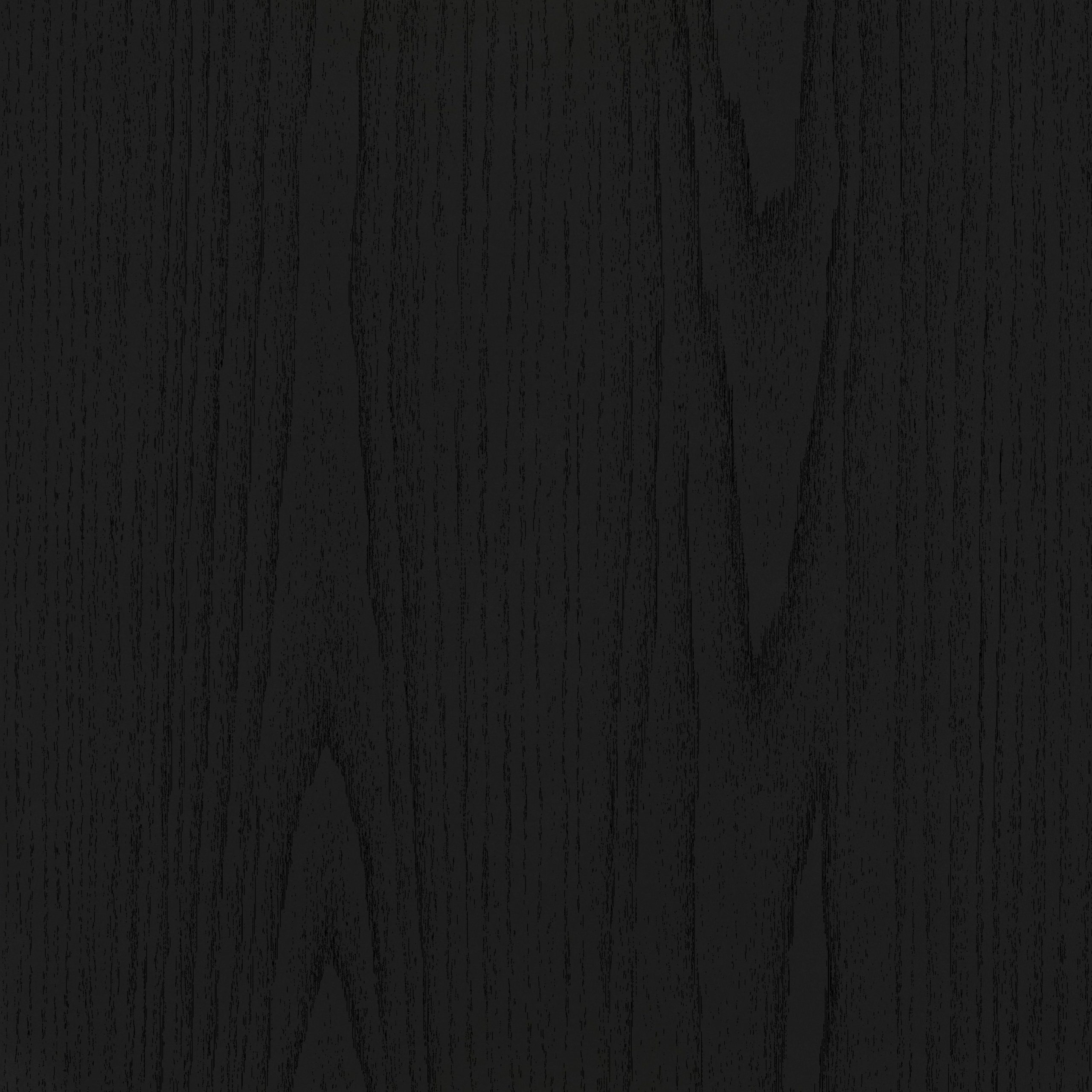 Ebonized black ash wood veneer swatch showcasing deep cathedral grain textures. Dramatic luxury cabinet finishes crafted by Urban Vista Cabinets.
